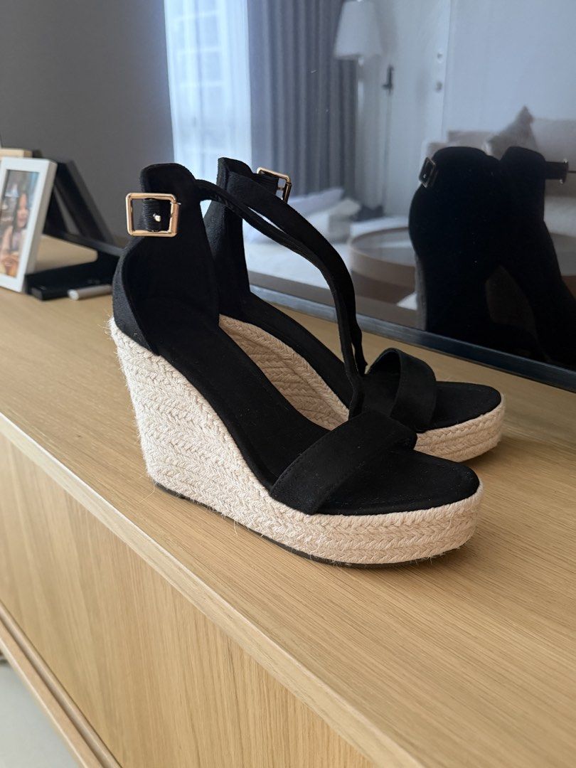 Black Espadrille Wedge Sandals with Ankle Strap (Category: Wedges) located in Manila. Submitted by ania_g (Listing ID 1466865984, Image 1). Description: - Style: Platform wedge sandals with woven jute heel - Color: Black with gold-tone hardware - Details: Open toe, wide front strap, and side buckle ankle closure - Size: 36 (marked on sole) - Condition: Clean, soles show minimal wear.