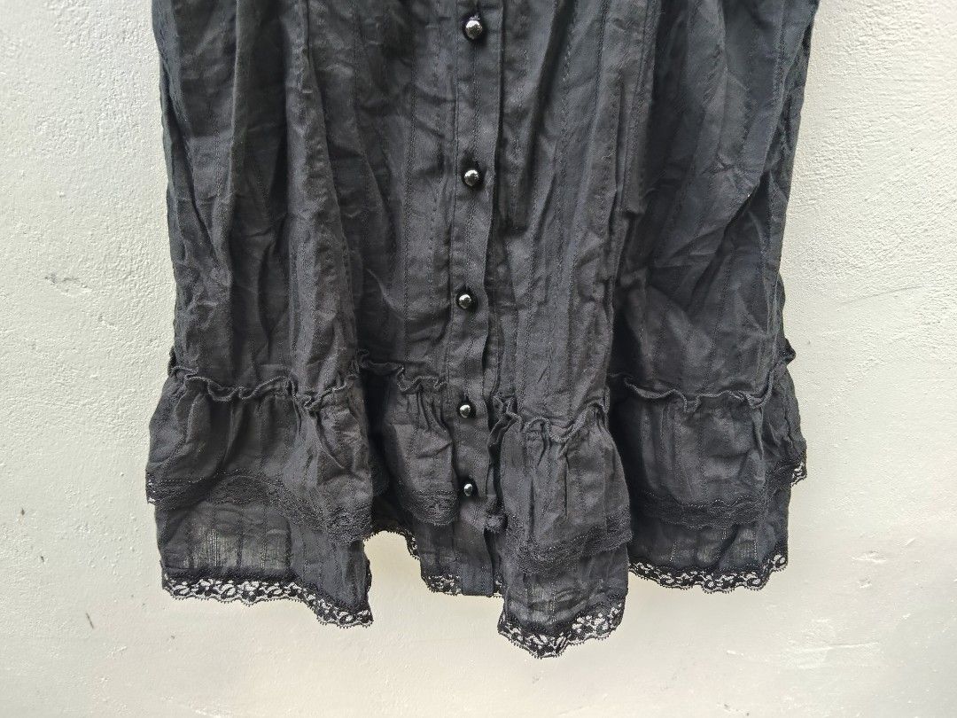 Black Lace Trim Button Front Tank Top (Category: Sleeveless) located in City of Isabela. Submitted by jasheverything (Listing ID 1466919088, Image 3). Description: - Color: Classic Black - Design: Button-front closure with gathered chest detail - Hem: Ruffle tiers accented with delicate lace trim - Straps: Wide straps featuring a subtle pattern - Material: Lightweight and breathable, ideal for layering or solo wear - Condition: Brand new/Excellen