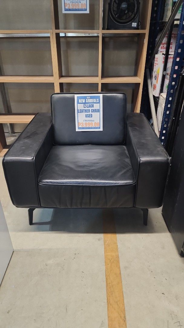 Black Leather Armchair (Category: Chairs) located in Cainta. Submitted by christine07. (Listing ID 1466774487, Image 1). Description: - Color/Material: Black leather - Frame: Sturdy metal legs with solid build quality - Comfort: Thick cushions for seat and backrest with wide armrests - Style: Clean, modern look suitable for most living rooms.