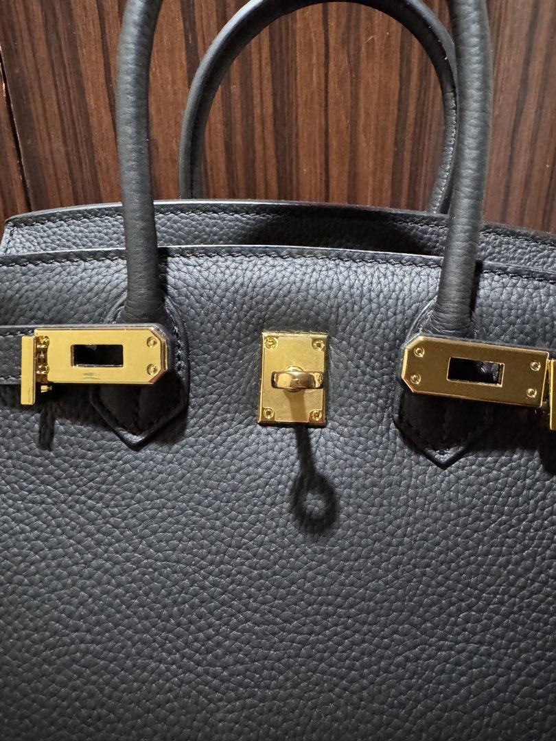 Black firkin 😘 (Category: Purses & Pouches) located in Quezon City. Submitted by chingkwayluh (Listing ID 1466879805, Image 2). Description: -Black genuine leather - Inclusions: long strap, gold padlock and key with smiley face bag charm - free twilly .