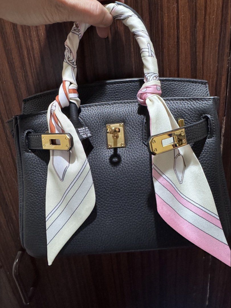 Black firkin 😘 (Category: Purses & Pouches) located in Quezon City. Submitted by chingkwayluh (Listing ID 1466879805, Image 1). Description: -Black genuine leather - Inclusions: long strap, gold padlock and key with smiley face bag charm - free twilly .