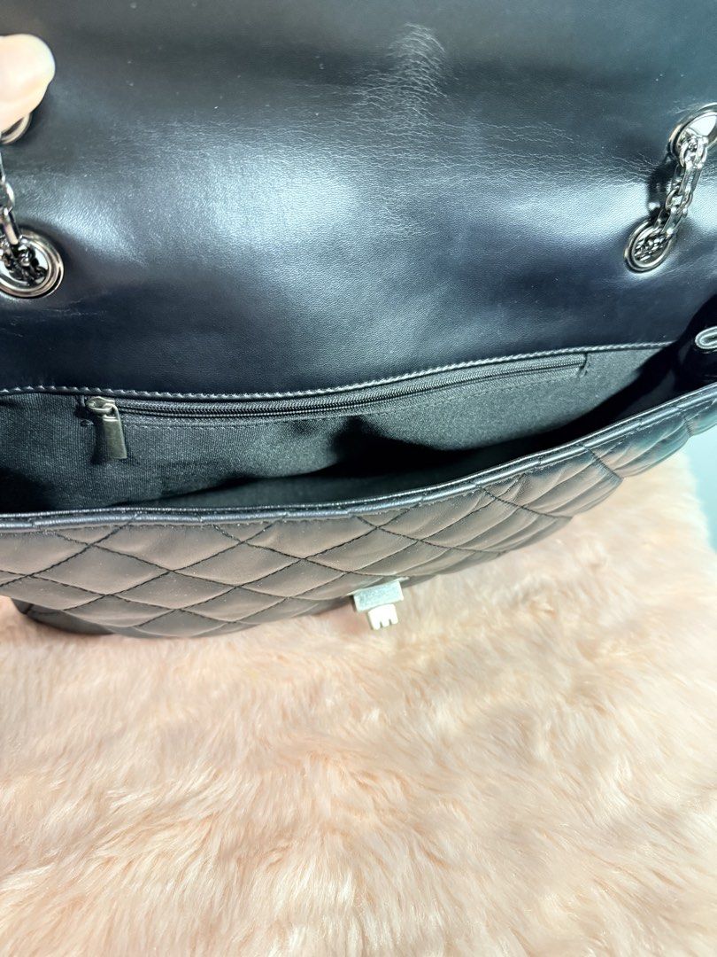 Black Quilted Shoulder Bag with Chain Strap (Category: Shoulder Bags) located in Quezon City. Submitted by shaberbree (Listing ID 1466915924, Image 2). Description: Quilted black leather shoulder bag with classic diamond stitching. Dark metallic chain straps and turn-lock closure on the front flap. Inside features a fabric lining with a zipped pocket for small items. Back slip pocket for easy access to your phone or cards. Roomy interior, great e