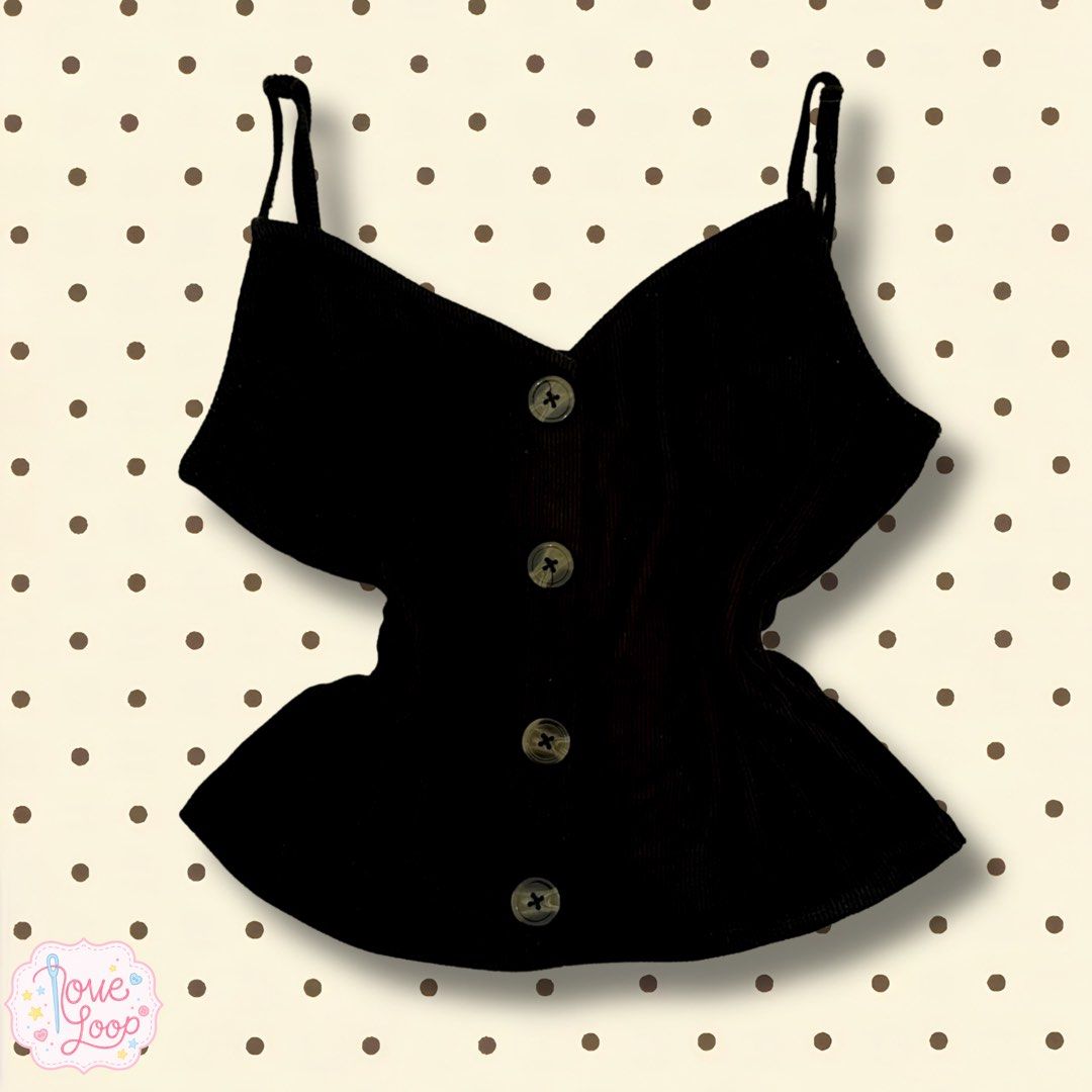Black ribbed cami tank top with buttons (Category: Sleeveless) located in Manila. Submitted by love.loop (Listing ID 1452781417, Image 1). Description: - Black ribbed cami tank top - Adjustable spaghetti straps - Button-up front - Slightly flared hem - Versatile for casual wear with jeans or skirts.