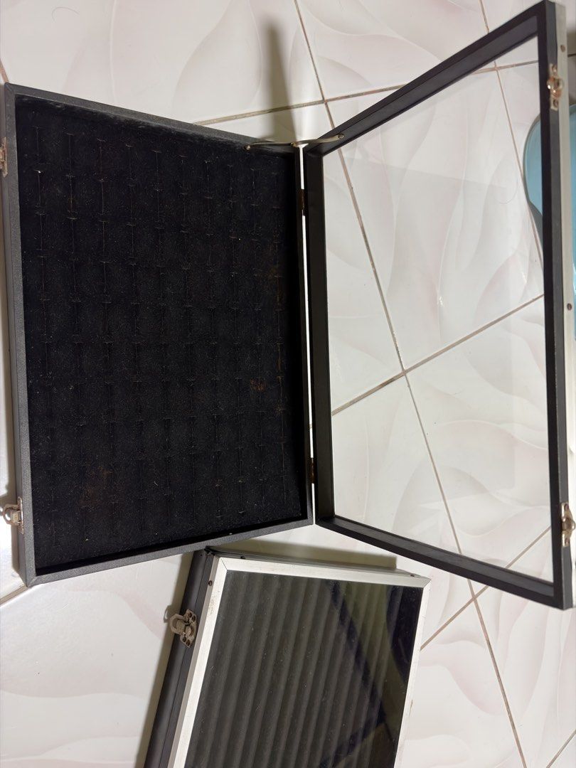 Black ring display box organizer with glass lid (Category: Accessory Holder, Box & Organizers) located in Makati City. Submitted by mjfernandez (Listing ID 1466859019, Image 2). Description: - Set of 2 black display cases for rings and small accessories - Clear glass top for easy viewing - Soft black velvet interior slots to keep items secure and organized - Silver metal frame with side latches - Sturdy and practical for market vendors or home st