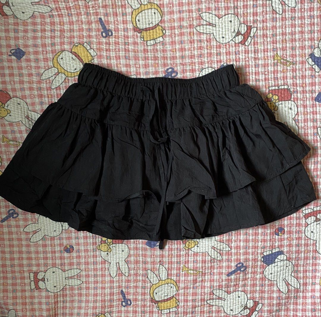 Black Ruffle Skort with Drawstring (Category: Skirts) located in Manila. Submitted by fluttershart (Listing ID 1466818556, Image 1). Description: - Color: Black - Design: Layered ruffle skirt with built-in shorts for extra comfort and coverage - Waistband: Elastic with a matching front drawstring for an adjustable fit - Fabric: Soft, lightweight, and easy to wear all day - Versatility: Perfect for casual looks, easily pairs with basic tees and to