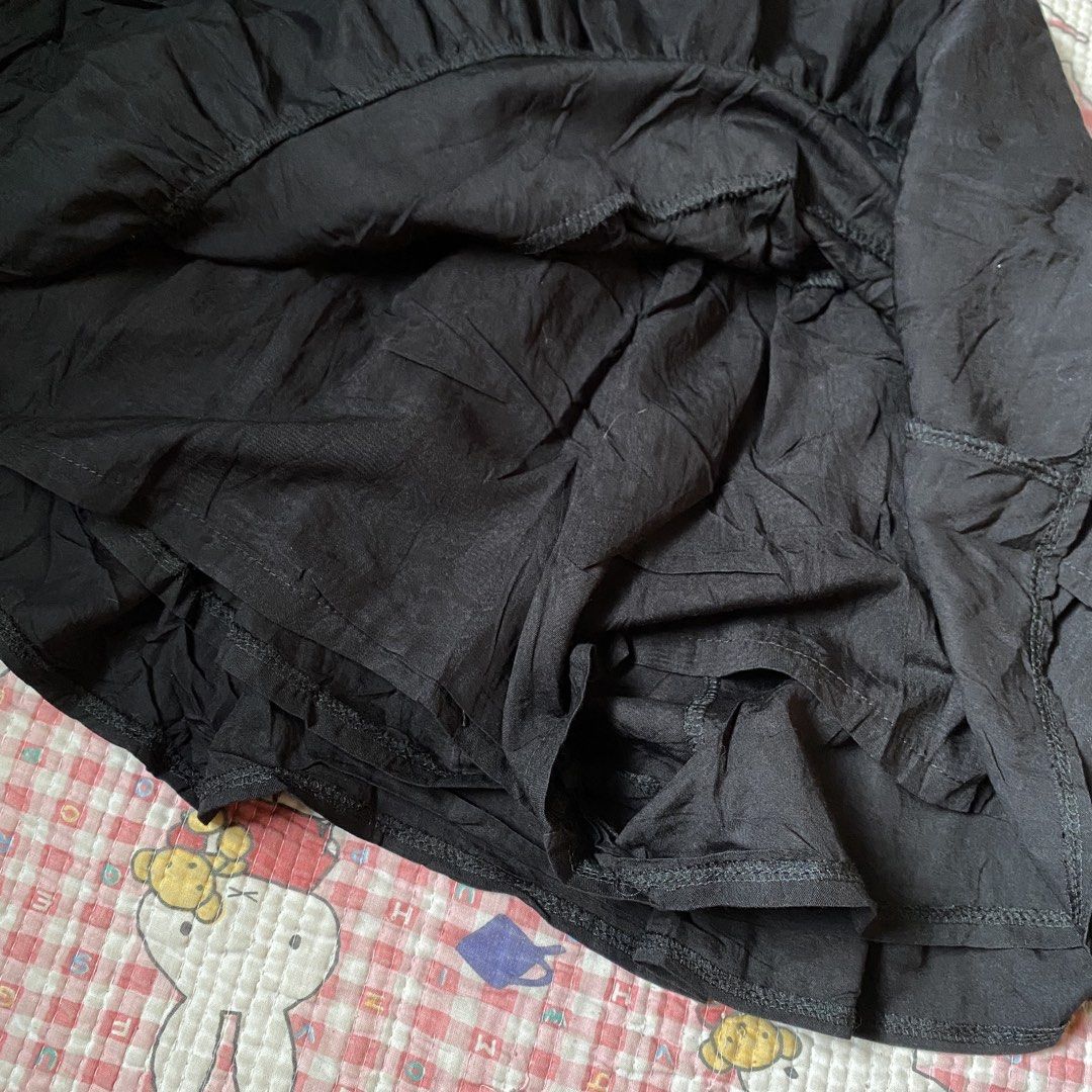 Black Ruffle Skort with Drawstring (Category: Skirts) located in Manila. Submitted by fluttershart (Listing ID 1466818556, Image 2). Description: - Color: Black - Design: Layered ruffle skirt with built-in shorts for extra comfort and coverage - Waistband: Elastic with a matching front drawstring for an adjustable fit - Fabric: Soft, lightweight, and easy to wear all day - Versatility: Perfect for casual looks, easily pairs with basic tees and to