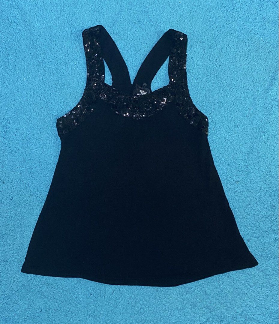 Black Sequin Tank Top Size S (Category: Sleeveless) located in Bacolod City. Submitted by bravefire_3fe6dd (Listing ID 1466806068, Image 1). Description: - Brand: Forever 21 - Size: Small - Material: 100% rayon - Color: Black with sparkling sequin trim on neckline and straps - Design: Racerback with a cute patterned ribbon tag at the collar - Condition: Great piece for parties, clubs, and going out - Shipping: Ships fast within the Philippines.
