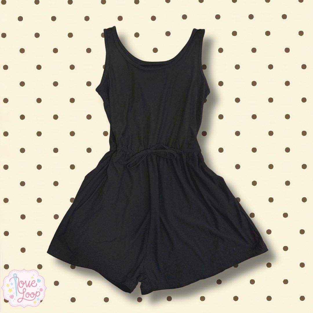 Black sleeveless scoop neck romper with drawstring waist (Category: Rompers) located in Manila. Submitted by love.loop (Listing ID 1466890974, Image 1). Description: - Color: Classic Black - Style: Sleeveless romper with flowy shorts - Neckline: Scoop neck on front and back - Waist: Elasticized with a matching tie drawstring for a snug fit - Fabric: Soft, breathable jersey material - Perfect for: Warm weather, casual outings, and easy everyday st