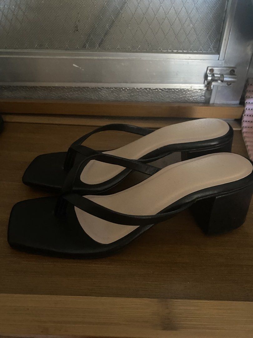 Black square toe block heel thong sandals (Category: Flats & Sandals) located in Las Pinas. Submitted by luvvjeon (Listing ID 1466801472, Image 2). Description: - Style: Slip-on thong strap sandals with a trendy square open toe - Heel: Comfortable and sturdy block heel for all-day wear - Color: Classic black upper with a neutral beige insole - Versatility: Easy to dress up or down for casual outings or events - Condition: Brand new and ready to s