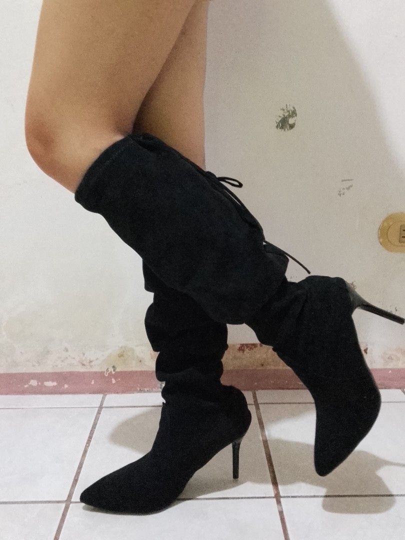 Black Suede Slouchy High Heel Boots (Category: Boots) located in Manila. Submitted by lehmicc (Listing ID 1466803498, Image 2). Description: - Color: Black - Material: Soft faux suede - Toe Style: Pointed toe with a sleek slim heel - Design: Tall slouchy shaft featuring adjustable ties at the top - Occasion: Ideal for parties, nights out, and dressing up - Condition: Brand new / excellent (ready to wear).