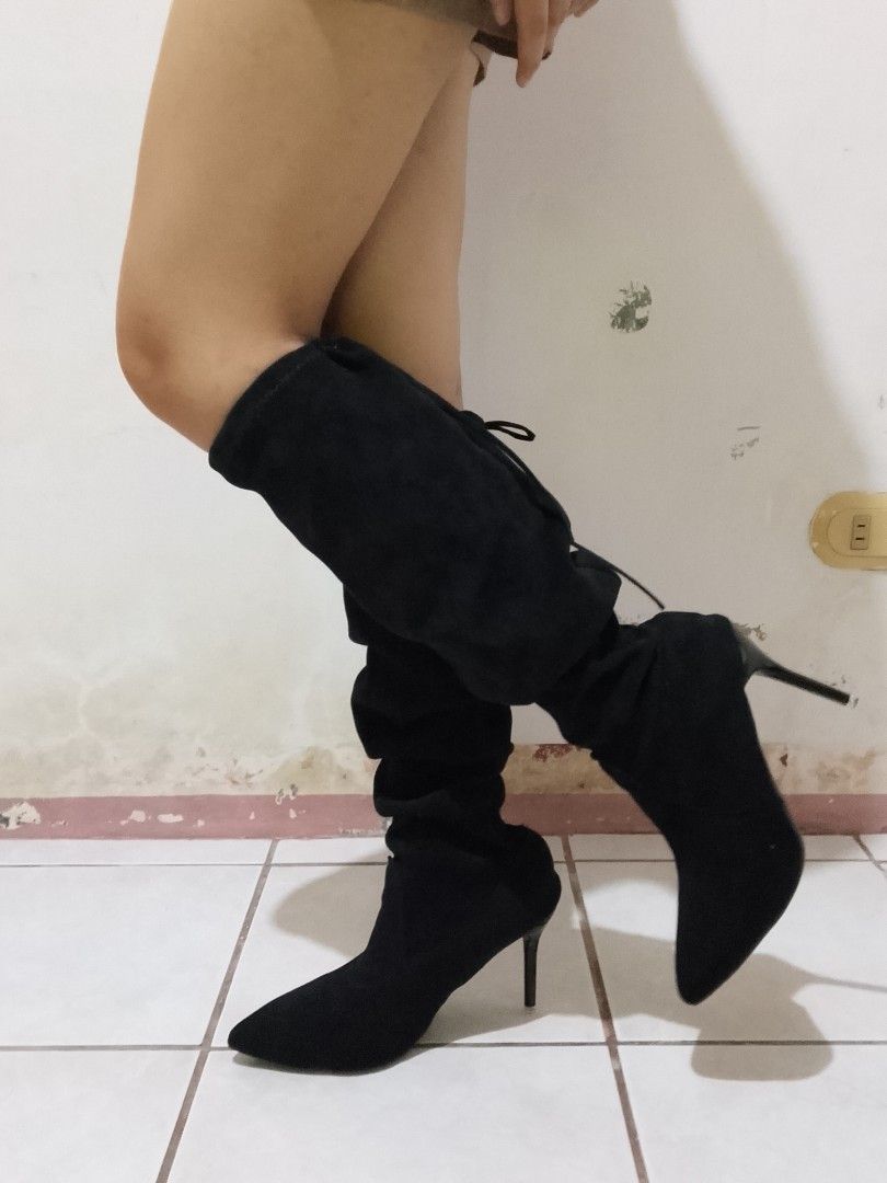 Black Suede Slouchy High Heel Boots (Category: Boots) located in Manila. Submitted by lehmicc (Listing ID 1466803498, Image 3). Description: - Color: Black - Material: Soft faux suede - Toe Style: Pointed toe with a sleek slim heel - Design: Tall slouchy shaft featuring adjustable ties at the top - Occasion: Ideal for parties, nights out, and dressing up - Condition: Brand new / excellent (ready to wear).