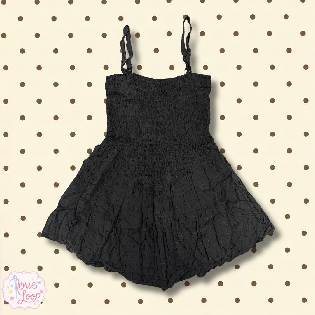 Black Swiss Dot Romper Smocked Bodice Spaghetti Strap (Category: Rompers) located in Manila. Submitted by love.loop (Listing ID 1466892065, Image 1). Description: - Color: Black - Material: Lightweight and breathable fabric - Design: Delicate Swiss dot texture with a playful flared short bottom - Fit: Stretchy smocked bodice for a snug and flattering fit - Straps: Thin spaghetti straps with adjustable buckles - Style: Easy slip-on style, perfect 