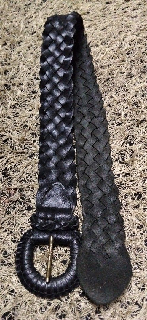 Black Woven pure solid genuine Leather Belt with Round Buckle (Category: Belts) located in Paranaque City. Submitted by michael-08 (Listing ID 1466851006, Image 3). Description: - Style: Classic vintage look, perfect for everyday outfits - Material: Sturdy black woven leather with a textured finish - Design: Wide braided strap with a rounded tip end - Hardware: Round leather-wrapped buckle featuring a gold-toned metal pin - Versatility: Great for