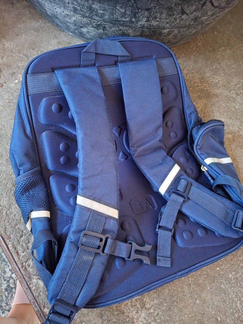 Blue and Green Multi-Pocket Backpack with Padded Straps (Category: Babies & Kids Fashion) located in Manila. Submitted by ethejampong (Listing ID 1466850603, Image 2). Description: brandnew po, never been used. Nakatambak lang din po dito kaya ibenta nalang Around 400-500 ang orig price neto - Color: Blue with vibrant green and white panel accents - Storage: Multiple front zipped compartments and a clear ID/card slot - Comfort: Ergonomic padded b