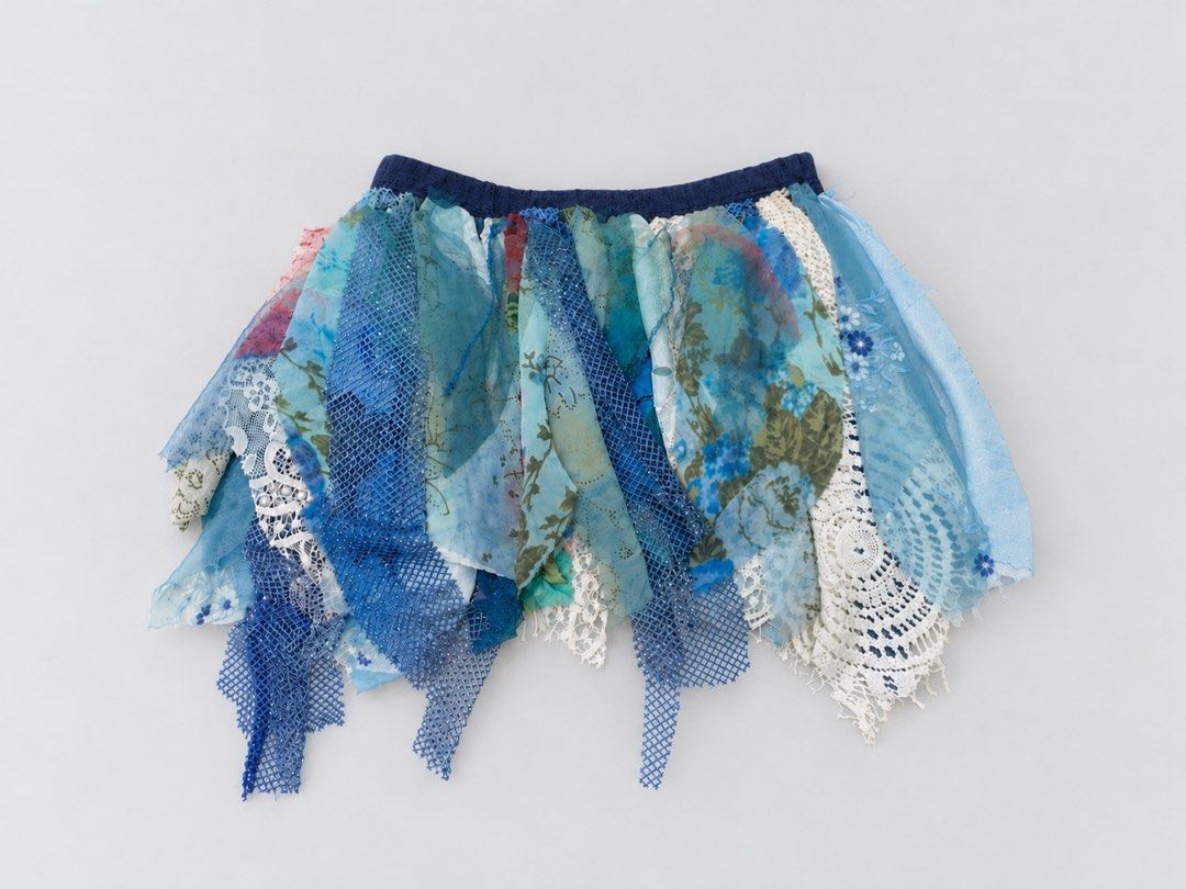 Blue patchwork rag skirt boho hippie festival style (Category: Skirts) located in Sarangani. Submitted by solune_clo (Listing ID 1466819331, Image 1). Description: - Style: Scrap-style, boho, festival-ready - Materials: Blue fabrics, mesh netting, floral prints, white crochet lace trim - Waistband: Comfortable dark blue elastic waistband - Design: Unique layered textured look with a jagged uneven hemline - Shipping: Fast shipping across PH via J&