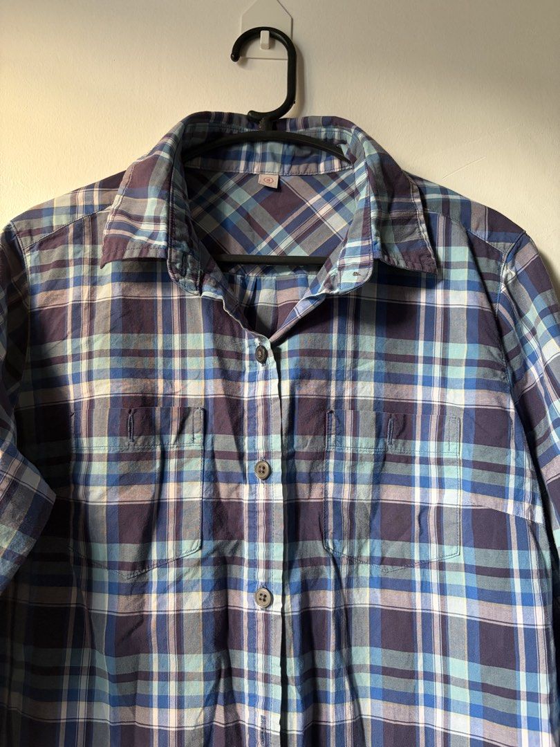 Blue Plaid Button-Down Shirt Dress (Category: Dresses) located in Las Pinas. Submitted by bibliomomma (Listing ID 1466856996, Image 2). Description: Blue plaid shirt dress with light blue and white accents. Features a button-down front, collared neckline, 3/4 sleeves, and front pockets. Casual, comfy, and easy to style for everyday wear. Can be worn as a dress or layered over jeans Pit to pit 18 inches when laid flat Length 31.5 inches.