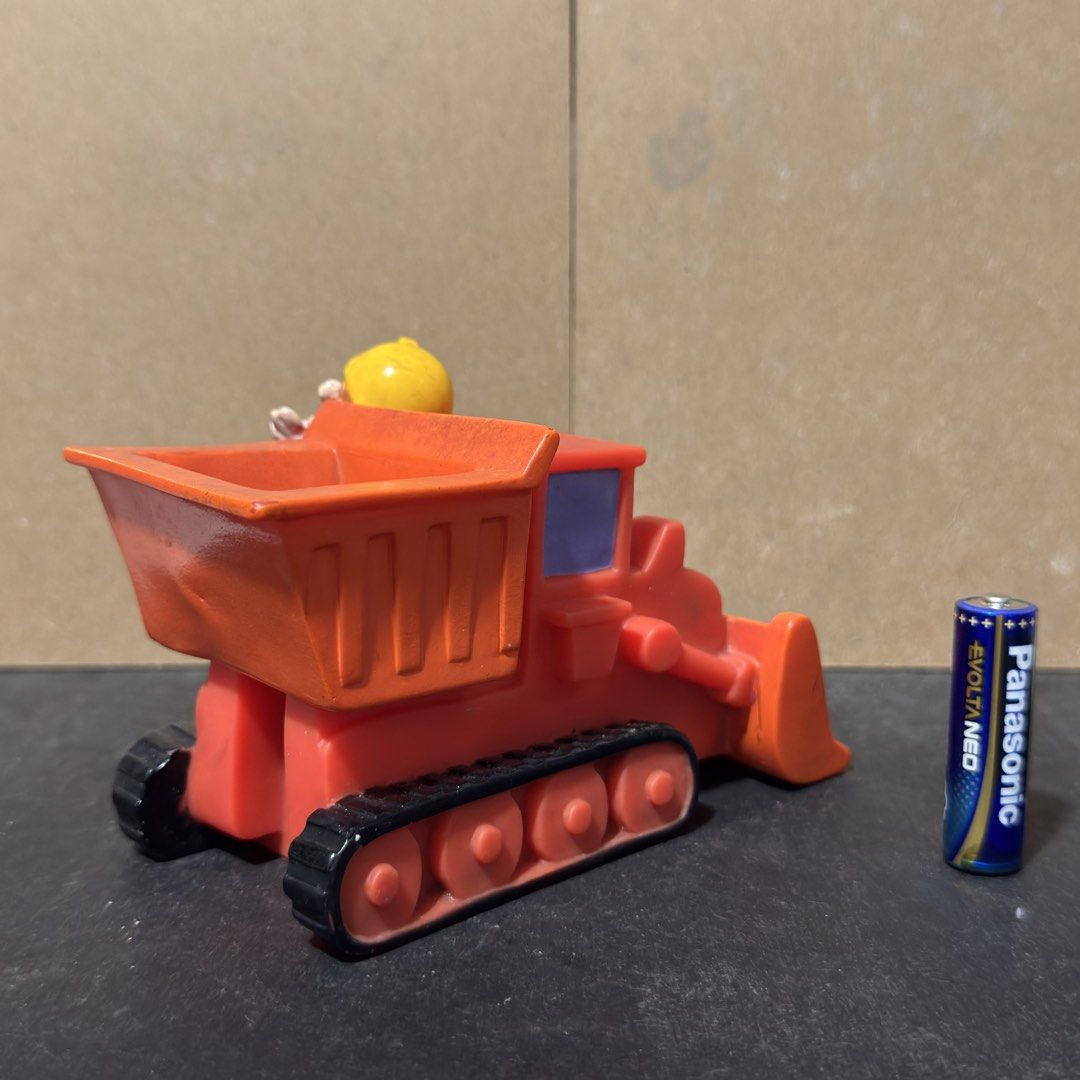 Bob the Builder Scrambler Toy Figure 2002 (Category: Vehicle & Diecast Models) located in Cuyapo. Submitted by blacksheepshop (Listing ID 1466785631, Image 3). Description: - Authentic 2002 Bob the Builder collectible toy (Hit Entertainment & Chapman copyright stamped on bottom) - Features Bob riding a vibrant red track vehicle with a bulldozer blade filled with fun blue bubble rocks - Durable molded plastic construction in orange, black, and red