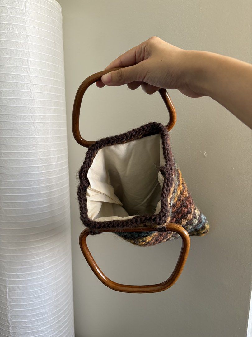 brown knit bag (Category: Beach Bags) located in Pasay City. Submitted by polly.unpockets (Listing ID 1466799774, Image 2). Description: - Clean cream fabric lining inside - Compact size ideal for daily essentials - Handmade look with a cozy texture.