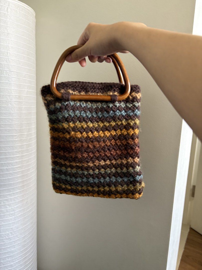 brown knit bag (Category: Beach Bags) located in Pasay City. Submitted by polly.unpockets (Listing ID 1466799774, Image 1). Description: - Clean cream fabric lining inside - Compact size ideal for daily essentials - Handmade look with a cozy texture.