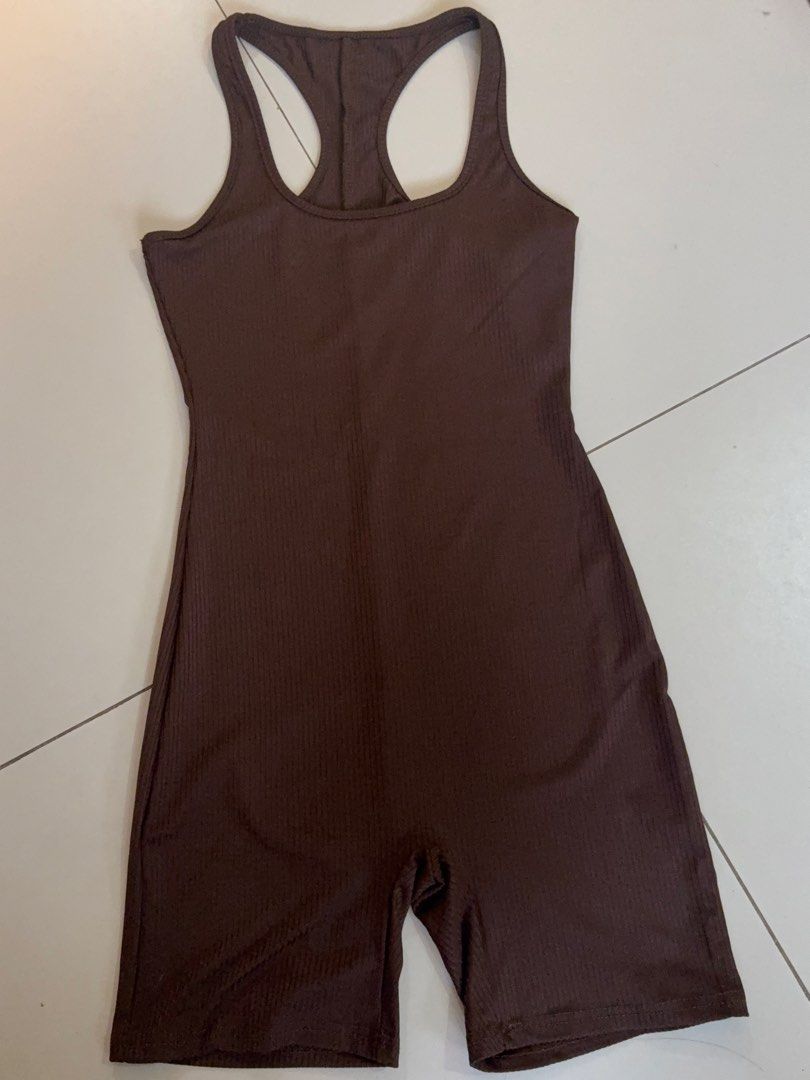 Brown ribbed racerback athletic romper jumpsuit activewear (Category: Jumpsuits) located in Cebu City. Submitted by declutterbarbie_ (Listing ID 1466825049, Image 1). Description: - Fits medium to large! - RFS: too big - Color: Brown - Style: Athletic romper with biker shorts length - Design: All-over ribbed texture, racerback, scoop neckline - Fit: Form-fitting and stretchy for maximum comfort - Ideal for: Workouts, yoga, or everyday lounging - 