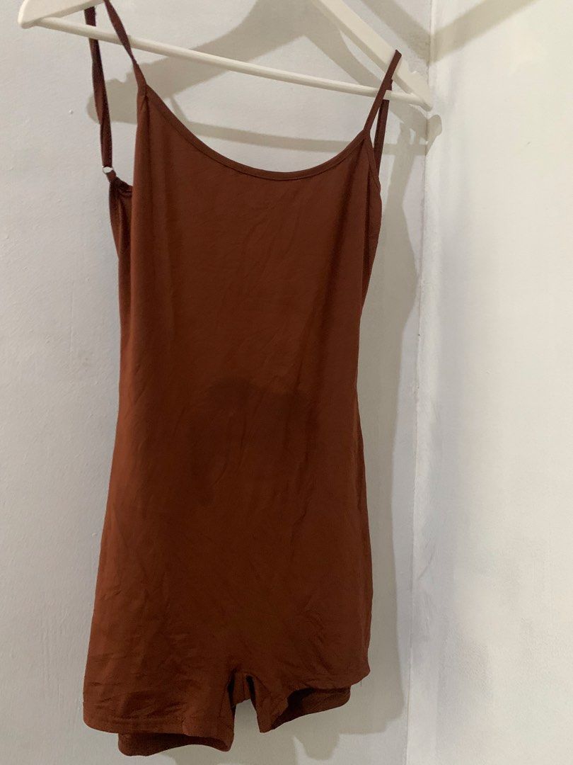 Brown Spaghetti Strap Romper with Ruched Back (Category: Rompers) located in Manila. Submitted by spaceshop12345 (Listing ID 1466867125, Image 3). Description: Brown romper with thin adjustable spaghetti straps. Scoop neckline in front and a low cut back with ruched detailing along the center seam. Built-in shorts style bottom. Soft, stretchy fabric. Great casual piece for lounging or running errands. Easy one-piece outfit..