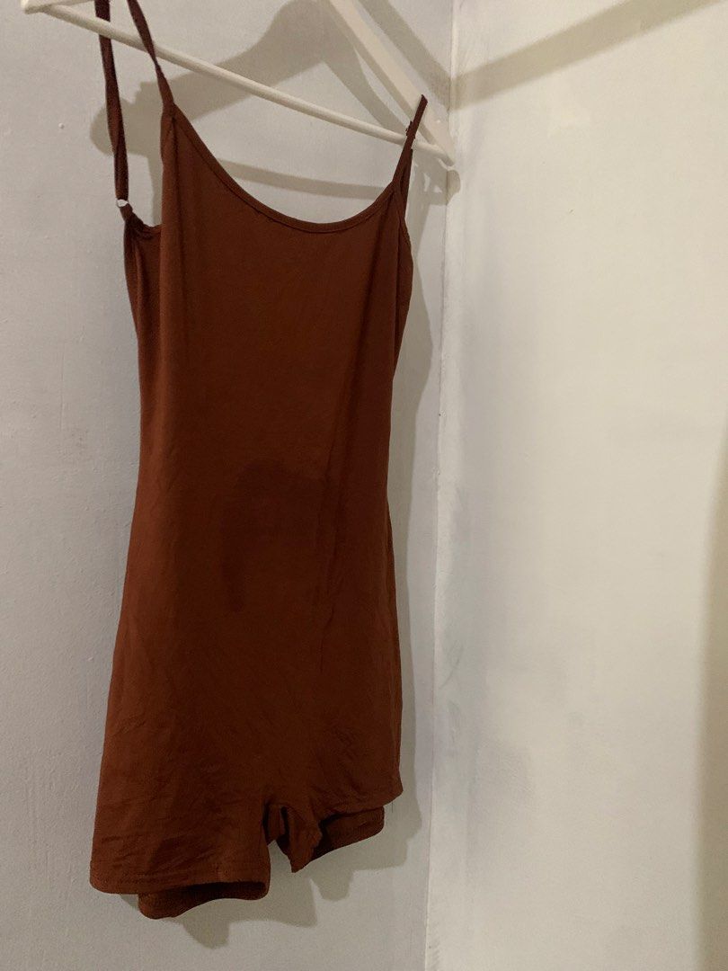 Brown Spaghetti Strap Romper with Ruched Back (Category: Rompers) located in Manila. Submitted by spaceshop12345 (Listing ID 1466867125, Image 2). Description: Brown romper with thin adjustable spaghetti straps. Scoop neckline in front and a low cut back with ruched detailing along the center seam. Built-in shorts style bottom. Soft, stretchy fabric. Great casual piece for lounging or running errands. Easy one-piece outfit..