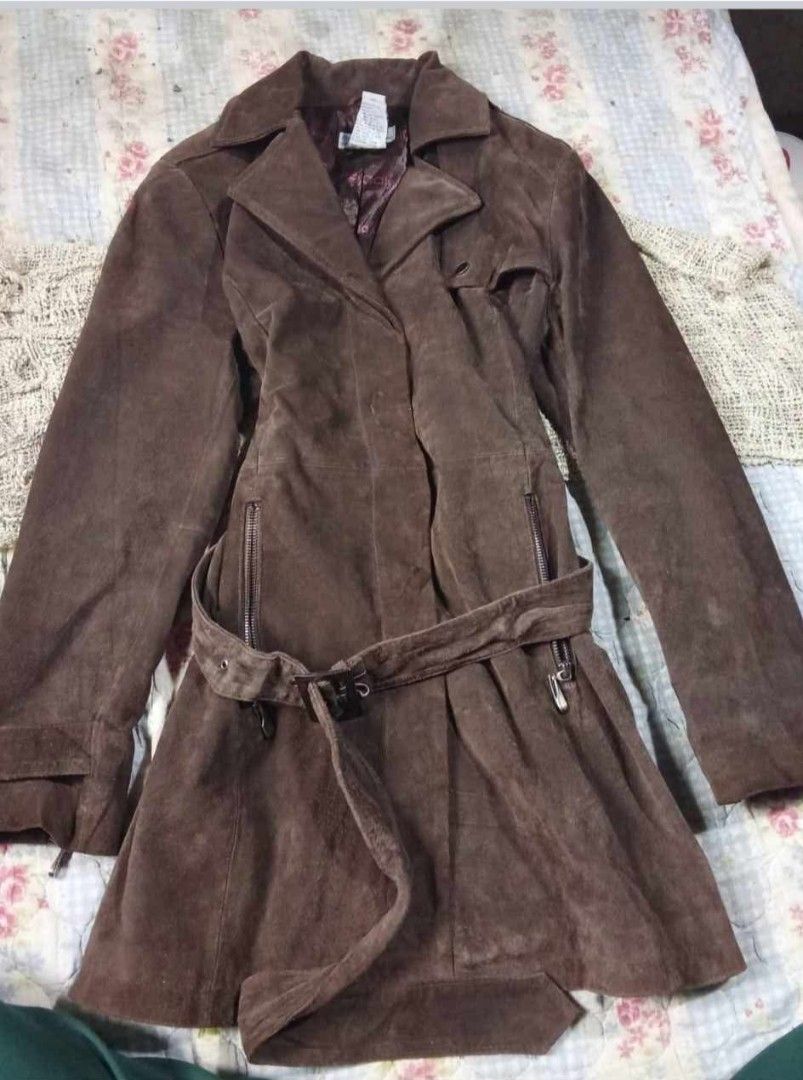 Brown Suede Trench with Belt (Category: Coats, Jackets and Outerwear) located in Manila. Submitted by naldnaldra61670 (Listing ID 1466890641, Image 1). Description: - Color: Deep brown - Material: Soft suede - Length: Long with matching waist belt - Closure: Button-up front with classic collar - Sleeves: Long with zippers at the cuffs - Style: Great layering piece for cooler weather - Needs Wash - XS to Small. Kasya ng Med pero fitted na..