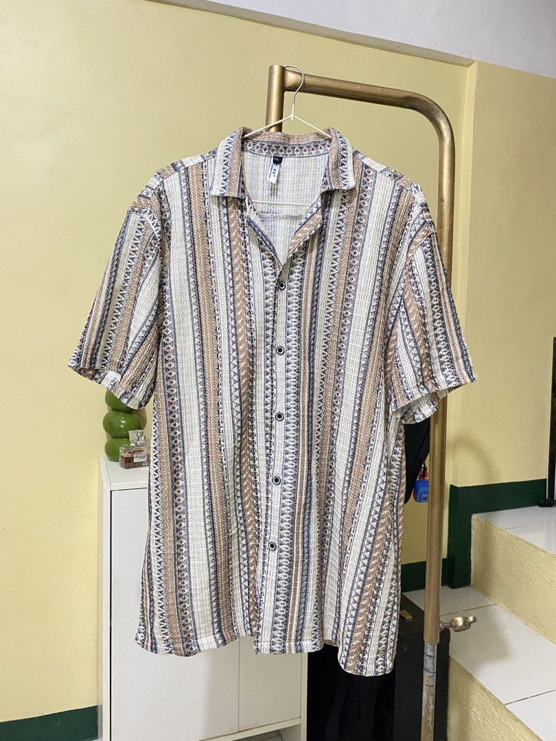 BROWN SUMMER POLO IN PATTERN (Category: Tshirts & Polo Shirts ) located in Dasmarinas. Submitted by hannah.oakph (Listing ID 1466832049, Image 1). Description: .