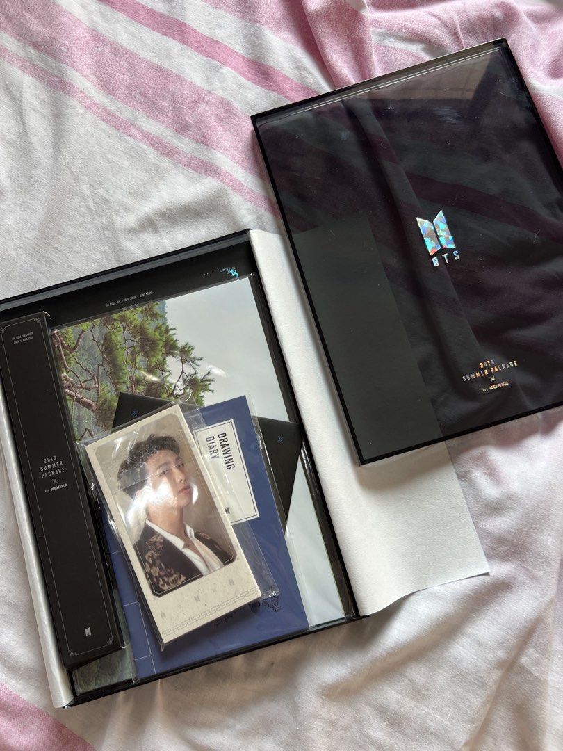 BTS 2019 Summer Package in Korea (Category: K-Wave Merchandise) located in Rizal. Submitted by eurea1864 (Listing ID 1466864197, Image 3). Description: - Official BTS 2019 Summer Package in Korea - Includes original black outer shipping box - Comes with photobook, RM photocard, and drawing diary - All other pictured inclusions included.