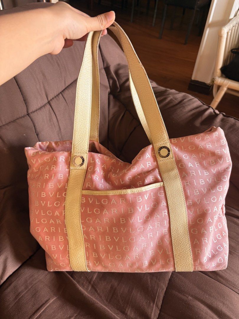 Bulgari Pink Monogram Canvas Tote Bag (Category: Luxury Bags & Wallets) located in Baguio. Submitted by cosmogyralfinds (Listing ID 1466783896, Image 1). Description: Pink monogram canvas tote bag by Bulgari. Cream leather handles and trim, gold tone hardware with logo detailing. Front slip pocket for easy access. Interior lined in light fabric with embossed leather brand tag. Spacious main compartment, comfortable shoulder strap drop. Classic Y2