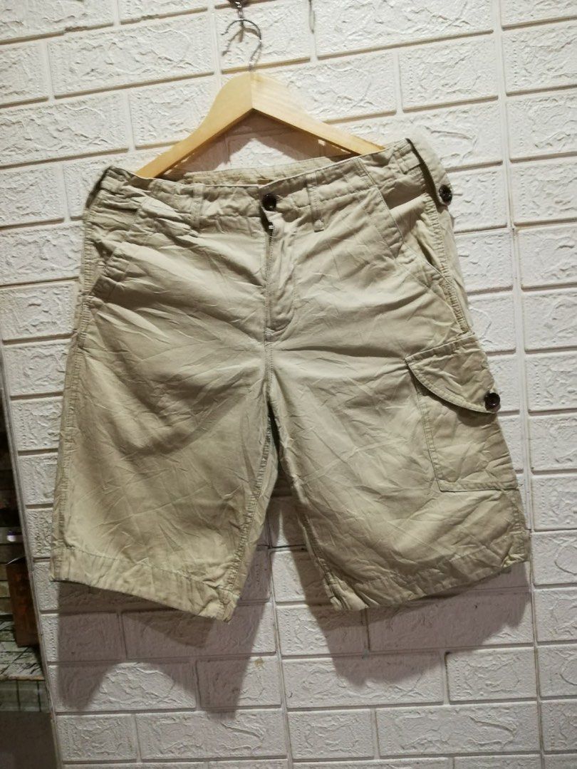 Burberry Brit Khaki Cargo Shorts (Category: Shorts) located in Rizal. Submitted by tiangarcia02 (Listing ID 1466931100, Image 1). Description: - Brand: Burberry Brit - Color: Khaki Beige - Material: 100% Cotton (Made in China) - Features: Multiple side and back pockets, stylish waist button details, and unique graphic print on the back right pocket - Care: Machine washable - Style: Casual, perfect for everyday wear.