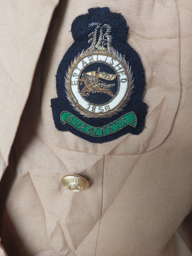 Burberrys Double Breasted Camel Blazer Jacket with Crest Patch (Category: Coats, Jackets and Outerwear) located in Caloocan City. Submitted by shikiibun (Listing ID 1466831042, Image 2). Description: - Brand: Vintage Burberrys - Style: Double-breasted blazer in classic camel - Details: Ornate gold-tone buttons and embroidered crest patch on chest - Lining: Iconic Nova Check interior lining - Size: 9AT (Tag indicates) - Condition: Needs steaming o