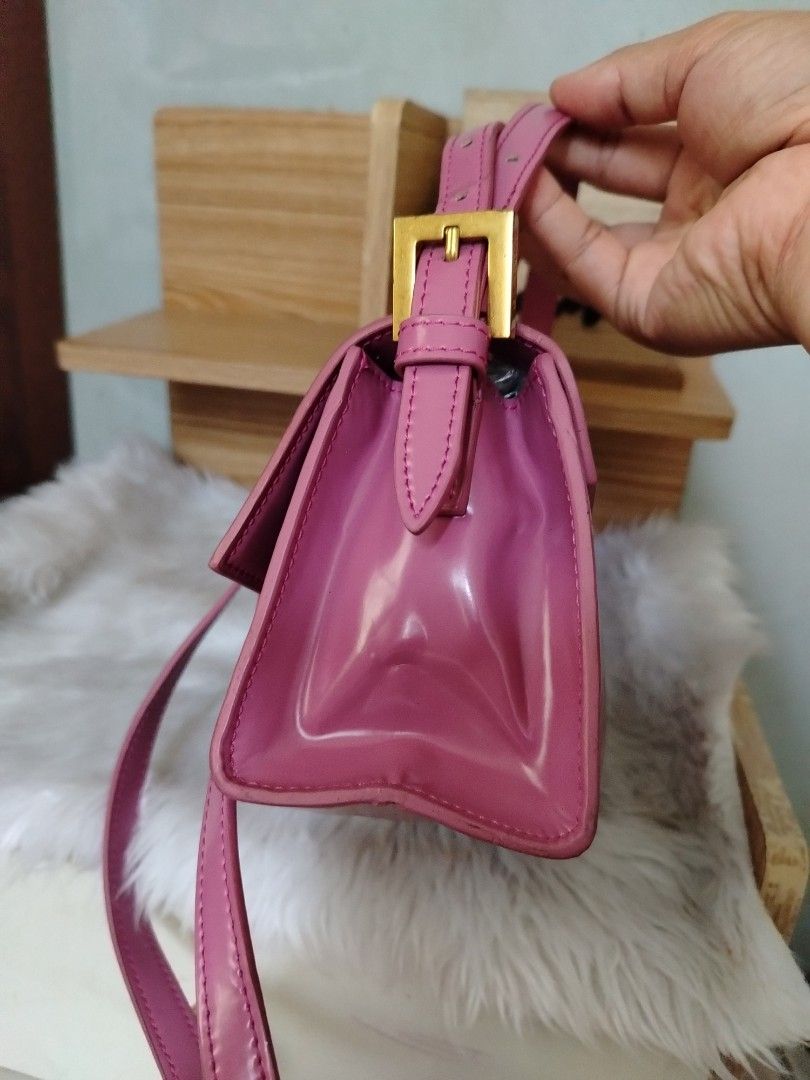 By Far Fran Minin (Category: Luxury Bags & Wallets) located in Lucena. Submitted by gracious_chin0436 (Listing ID 1466792122, Image 3). Description: - Brand: By Far - Color: Pink - Material: Patent Leather - Style: Structured boxy shoulder bag - Closure: Front flap with magnetic snap button - Hardware: Premium gold-tone accents and logo buckle - Strap: Adjustable - Condition: have some deform on side part slight creased .