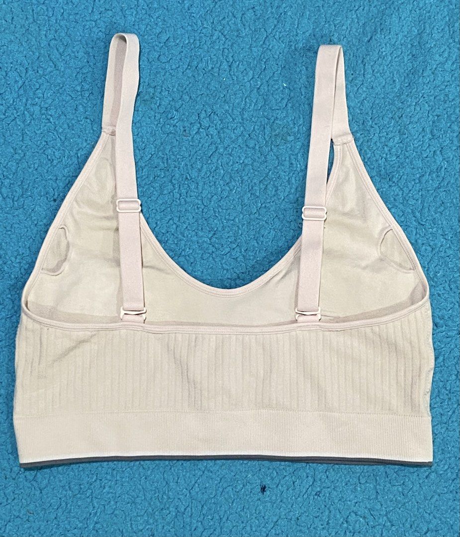 Calvin Klein Beige Ribbed Bralette with Adjustable Straps (Category: Sleeveless) located in Bacolod City. Submitted by bravefire_3fe6dd (Listing ID 1466805738, Image 2). Description: - Brand: Calvin Klein - Color: Classic Beige - Design: Scoop neck with adjustable back straps - Band: Comfortable elastic underband with iconic CK logo text - Padding: Includes removable cup inserts - Material: Stretchy, seamless fabric for all-day comfort - Conditio