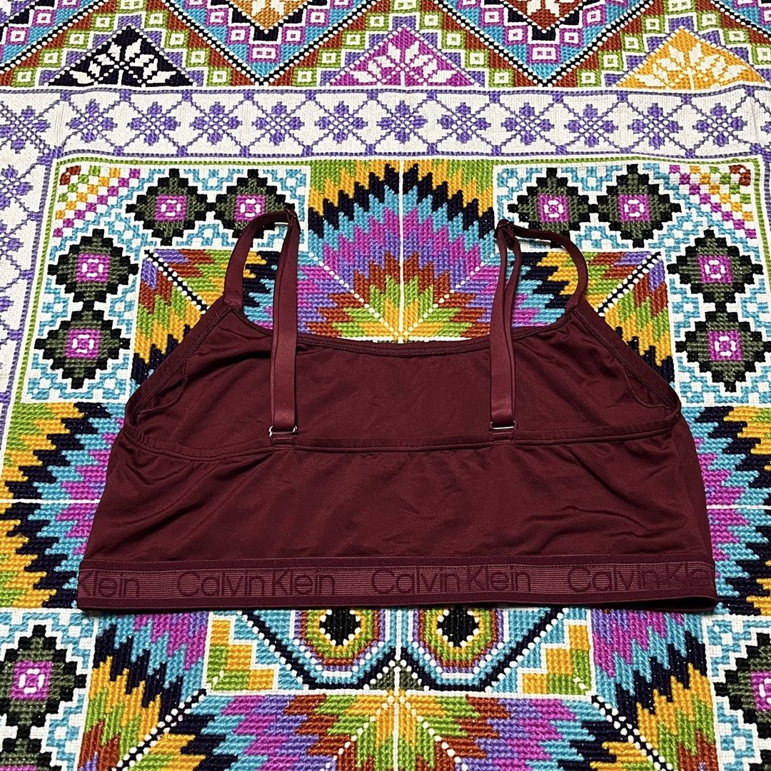 Calvin Klein Maroon Bralette Size L (Category: Undergarments & Loungewear) located in Dagupan City. Submitted by vernzkee (Listing ID 1466820917, Image 2). Description: - Brand: Calvin Klein - Item: Bralette - Color: Maroon / Dark Red - Size: Large (95cm bust tag) - Features: Elastic logo underband, adjustable straps, smooth fabric cups - Origin: Made in Indonesia - Condition: Brand new / Excellent Location: Dagupan City, Pangasinan MOP: Gcash, G