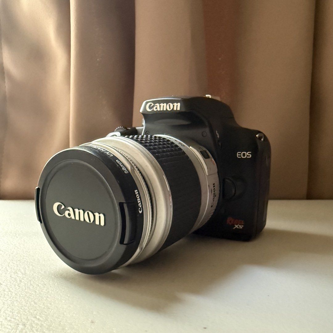 Canon EOS Rebel XS DS126191 (Category: Cameras) located in Manila. Submitted by cheemkenn (Listing ID 1466835040, Image 1). Description: Canon EOS Rebel XS (1000D) DSLR Camera Package Selling a Canon EOS Rebel XS DSLR camera kit. A great, lightweight beginner DSLR camera setup perfect for photography beginners, students, or hobbyists looking to get into real camera photography. What’s Included: - Canon EOS Rebel XS Body - Silver Canon Zoom Lens (