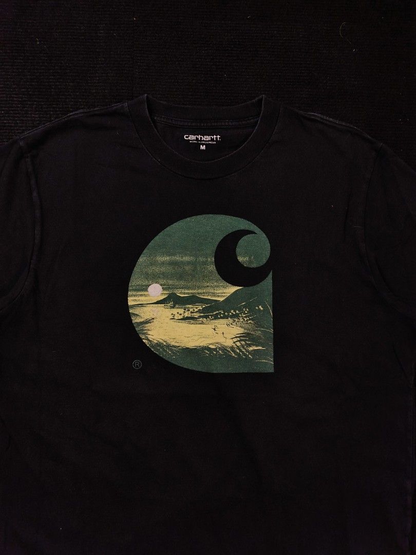 Carhartt Big Logo (Beach) (Category: Tshirts & Polo Shirts ) located in San Fernando. Submitted by gaboo_asncn (Listing ID 1466928237, Image 3). Description: - Carhartt Big Logo (Beach) - Size: Medium on tag (W22/L28.5) - Condition: Excellent - Color Rate: 9/10 - No issue Take note: The shirt is black, and since the carpet/background is also black, the color may look slightly faded or less vibrant in the photos. In actual lighting, the shirt has 