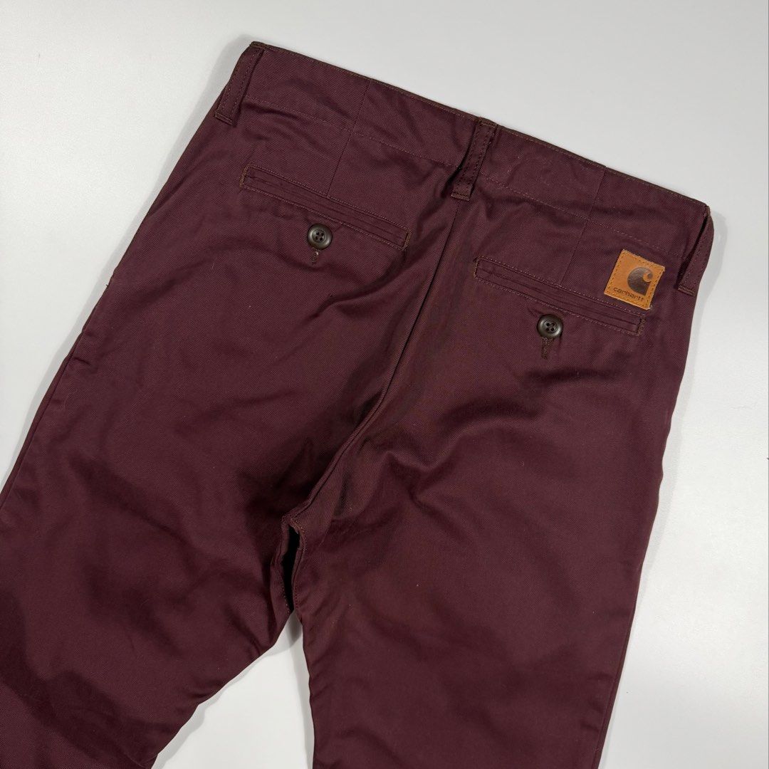 Carhartt Club Pant (Category: Jeans) located in Bacolod City. Submitted by freshstuff13 (Listing ID 1466830210, Image 3). Description: - Brand: Carhartt - Model: Club Pant - Color: Burgundy - Size: 28x32 - Material: 100% cotton twill - Closure: Button closure with zip fly - Pockets: Dual front pockets and dual buttoned welt back pockets - Details: Iconic square Carhartt brand patch on the rear pocket - Condition: Clean interior lining with printe