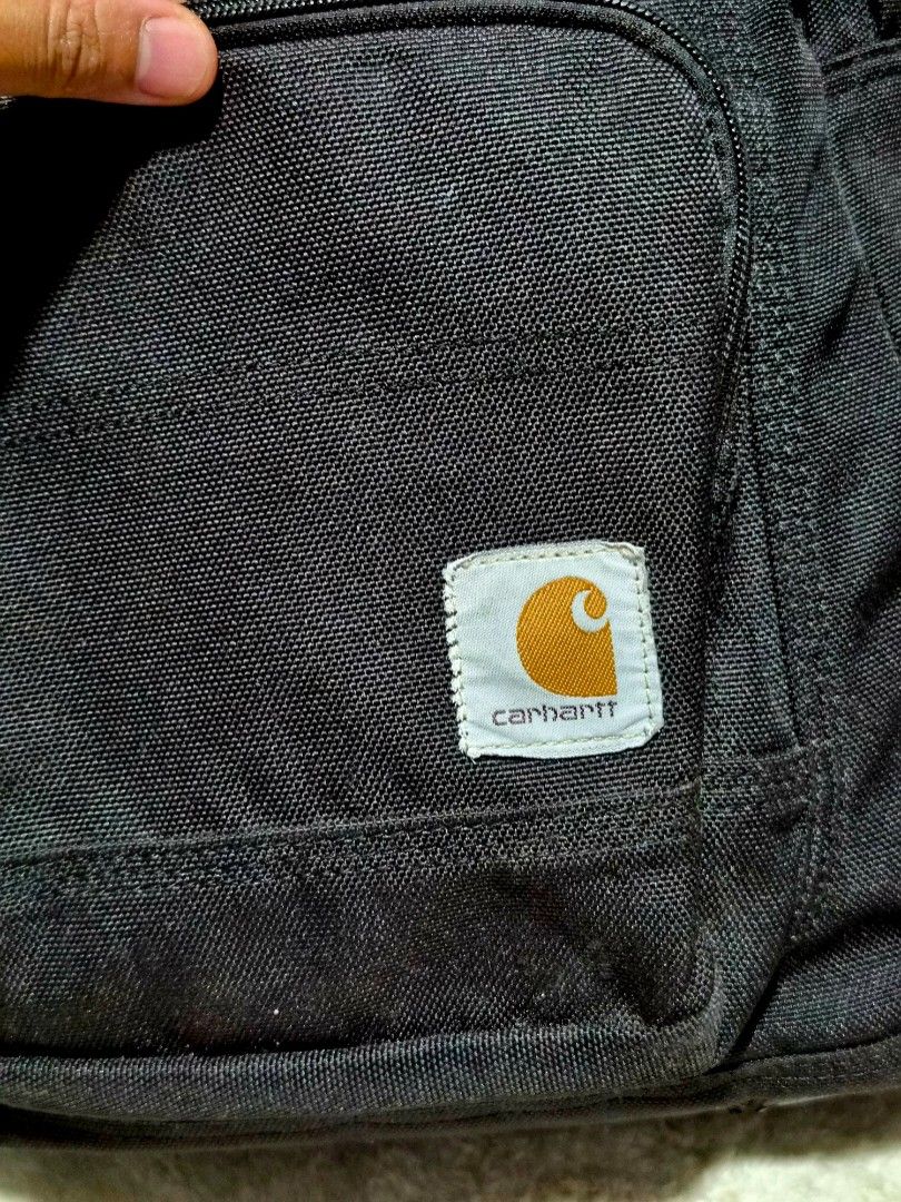 Carhartt Legacy Classic Work Pack Black Backpack (Category: Backpacks) located in Mandaue City. Submitted by chuchi152615 (Listing ID 1466927311, Image 3). Description: - Brand/Model: Black Carhartt Legacy Classic Work Pack (Style 19032501) - Material: Ultra-durable canvas built to last - Compartments: Spacious dual-zip main compartment and convenient front zip pocket - Interior: Clean lining with an organized sleeve and secure velcro strap - Com
