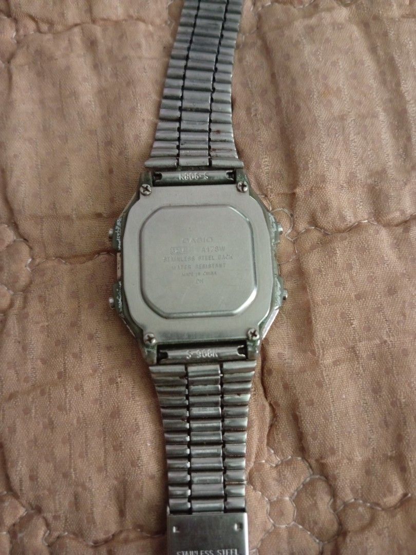 Casio A178W Vintage Digital Watch (Category: Men's Watches) located in Pasig City. Submitted by dhays27 (Listing ID 1466807228, Image 2). Description: - Model: Casio A178W with stainless steel bracelet - Features: Dual time, alarm chrono, and reliable 10-year battery - Condition: Fully working LCD screen; shows normal wear around the case bezel and buttons - Authenticity: Backplate stamped with model number and water-resistant rating - Perfect ev