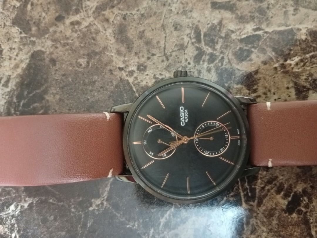 Casio MTP-B105 wristwatch with brown leather strap (Category: Men's Watches) located in Caloocan City. Submitted by grandmountain_ca5a79 (Listing ID 1466794065, Image 2). Description: - Model: Casio MTP-B105 (Module 5523) - Dial: Black with elegant rose gold hands, hour markers, and two sub-dials - Strap: Genuine brown leather with contrast white stitching and standard buckle - Movement: Reliable battery-operated quartz - Durability: Stainless st