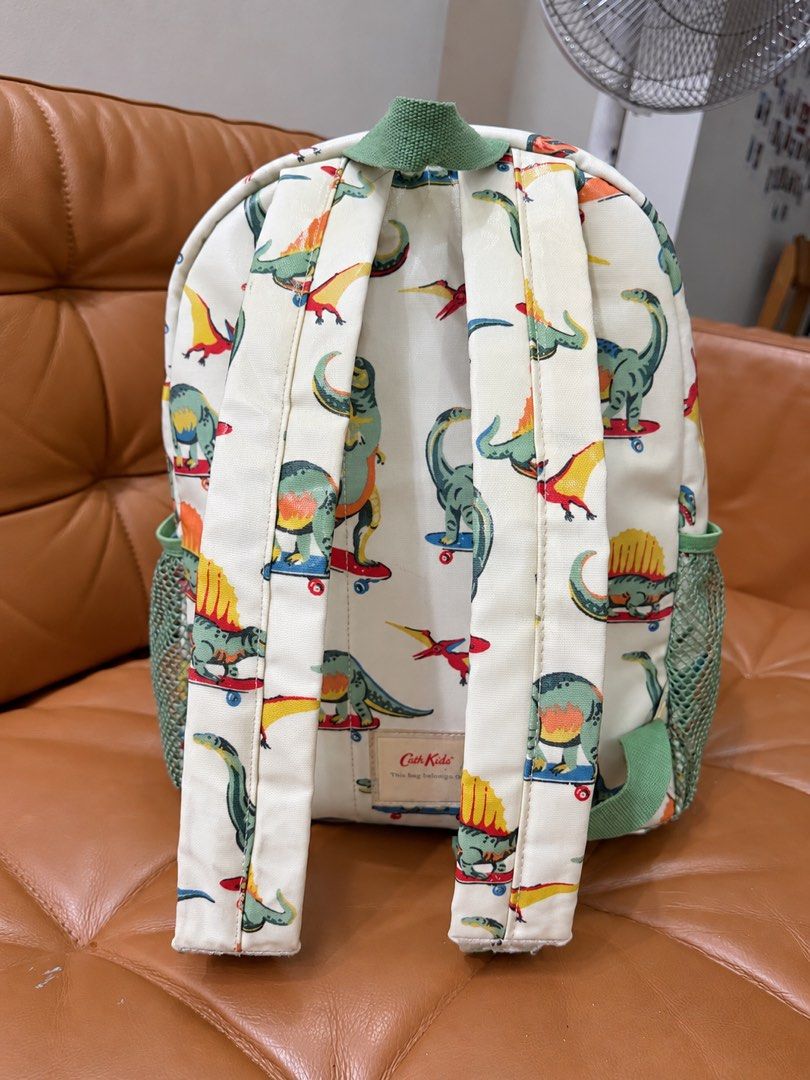 Cath Kids Dinosaur Kids Backpack (Category: Babies & Kids Fashion) located in Pasig City. Submitted by hellolala.94 (Listing ID 1466897118, Image 3). Description: Cath Kidston Has very minimal dirt marks near the bottom of the straps, as shown in the photo. Other than that, the bag is still in great overall condition. The quality is really nice and the bag is still beautiful and well-maintained..