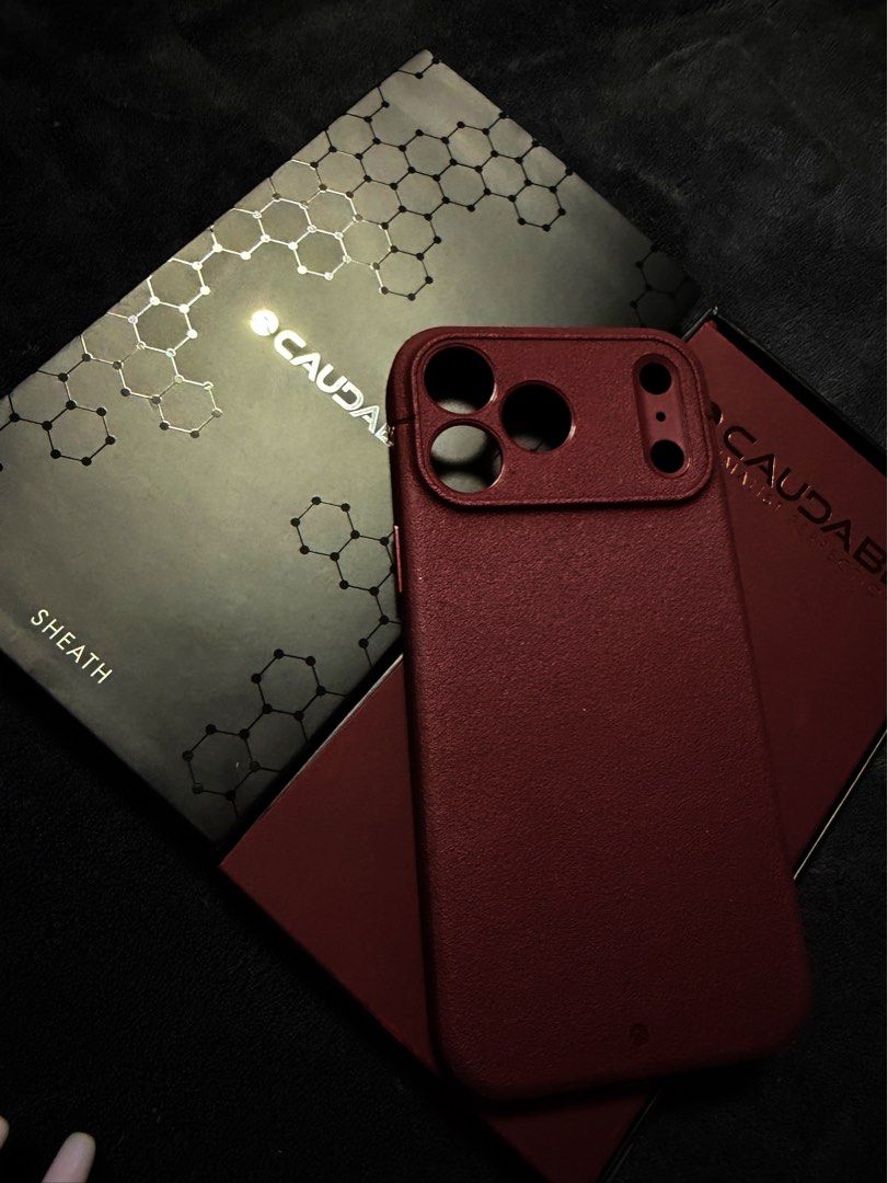Caudabe SHEATH IPHONE 17 PM (Category: Cases & Sleeves) located in Santa Rosa. Submitted by traveljewelsnbags (Listing ID 1466889234, Image 1). Description: CANYON Minimalist Perfection! Clean Covered Buttons Burgundy Color pag lagay mo sa 17PM mo PARA ka na Din na 18PM🫶🏼.