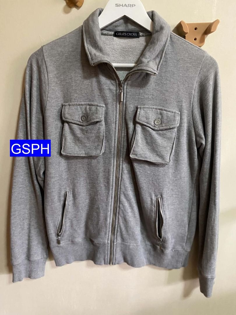 Celes Cross Grey Zip Up Jacket with Cargo Pockets (Category: Coats, Jackets and Outerwear) located in Makati City. Submitted by goodiesstuff_ph_17119811 (Listing ID 1466858546, Image 1). Description: - Brand: Celes Cross - Color: Grey - Style: Zip-up jacket with high collar - Pockets: Two chest pockets with button flaps and two lower zip pockets - Details: Full front metal zipper, ribbed cuffs and hem - Measurements (laid flat): Length 24", Sleev