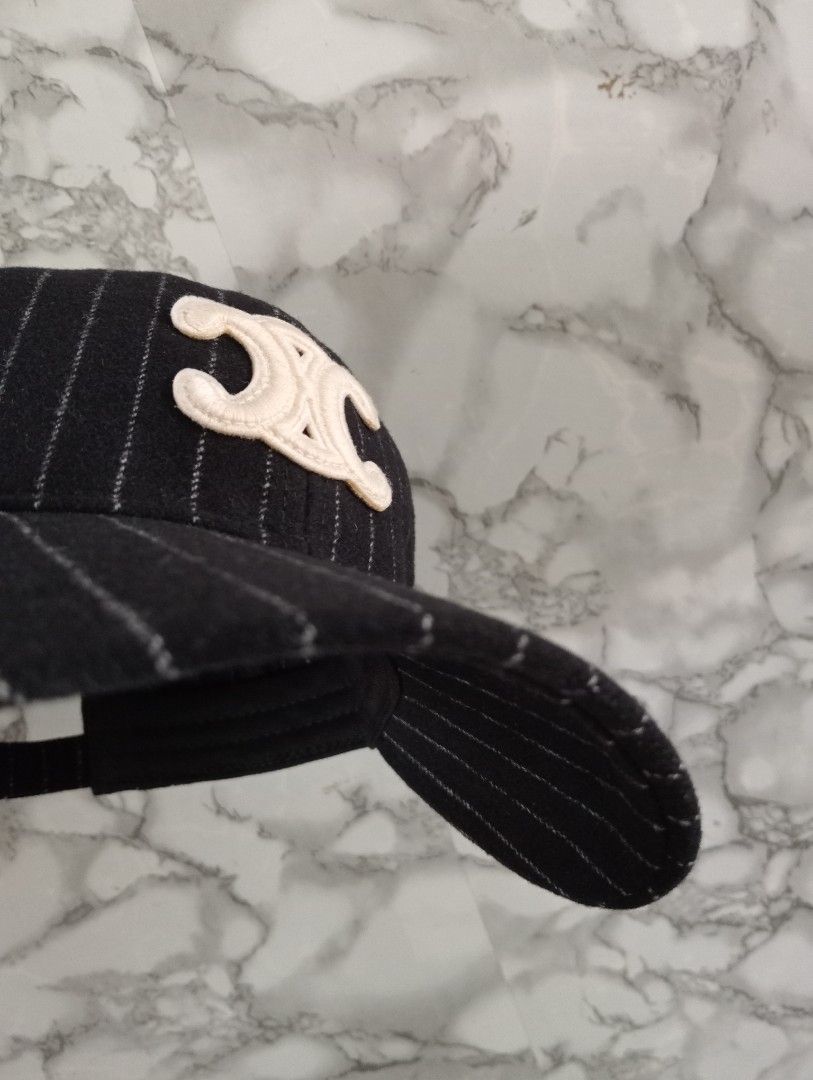 Celine Pinstripe Baseball Cap with Triomphe Patch Size M (Category: Caps & Hats) located in Tarlac. Submitted by luxsourze (Listing ID 1466968247, Image 1). Description: Celine Paris Cap in Black with White Pinstripes. Made in France Large Embroidered Triomphe Logo patch on the front in cream. Adjustable Back Strap featuring a gold-tone buckle with engraved Celine branding. Interior lined with Celine Logo tape. Size medium tag attached inside. Ad