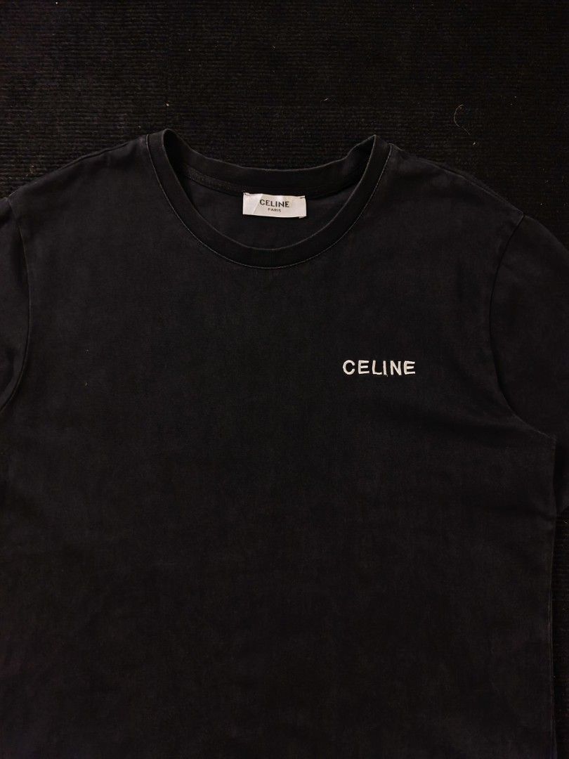 Celine script black tee (Category: Tshirts & Polo Shirts ) located in San Fernando. Submitted by gaboo_asncn (Listing ID 1466907026, Image 3). Description: - Celine script black tee - Size: XL on tag (W22/L28) - Condition: Excellent - Color Rate: 9.5/10 - No issue Take note: The shirt is black, and since the carpet/background is also black, the color may look slightly faded or less vibrant in the photos. In actual lighting, the shirt has a normal