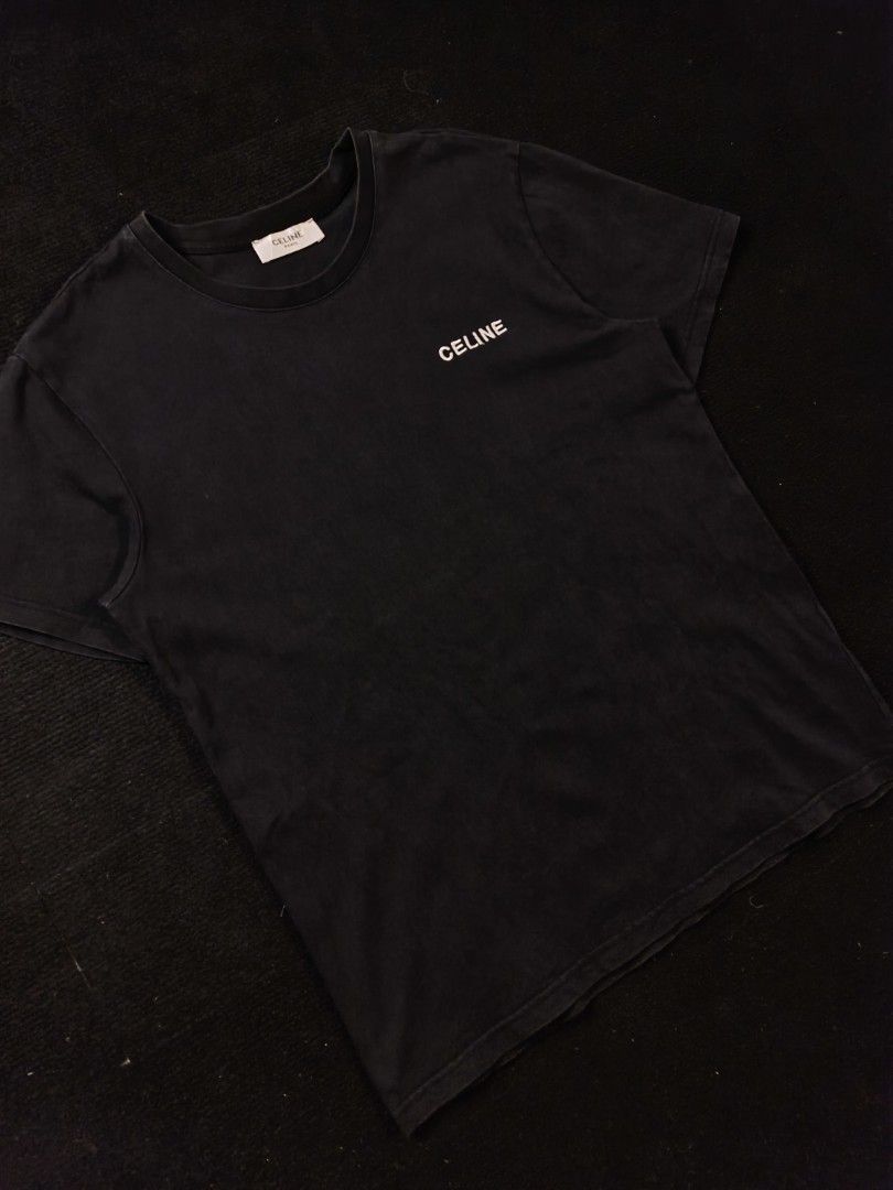 Celine script black tee (Category: Tshirts & Polo Shirts ) located in San Fernando. Submitted by gaboo_asncn (Listing ID 1466907026, Image 1). Description: - Celine script black tee - Size: XL on tag (W22/L28) - Condition: Excellent - Color Rate: 9.5/10 - No issue Take note: The shirt is black, and since the carpet/background is also black, the color may look slightly faded or less vibrant in the photos. In actual lighting, the shirt has a normal
