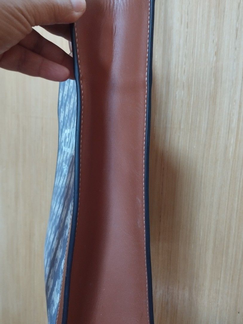 Celine Vertical Cabas Monogram Tote Bag with Strap (Category: Luxury Bags & Wallets) located in Baguio. Submitted by katgon2016 (Listing ID 1466903742, Image 3). Description: - Authentic Celine in coated canvas with brown leather trim - Features bold white Celine Paris branding on the front - Double top handles and an adjustable shoulder strap for crossbody wear (non- Celine brand/replaced) - Structured vertical shape with clean side gussets - Gr
