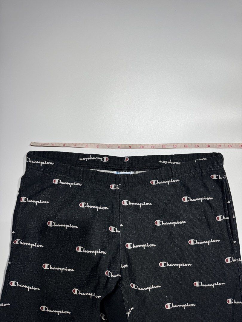 Champion All-Over Print Black Shorts (Category: Shorts) located in Cavite. Submitted by dracokidstuff (Listing ID 1466838496, Image 3). Description: - Brand: Champion - Color/Pattern: Black with all-over logo print - Material: Soft and comfortable cotton blend - Features: Elastic waistband for a secure, adjustable fit - Style: Trendy streetwear piece, great for casual everyday wear - Measurements (approximate): * Waist width: 16.5 inches * Length