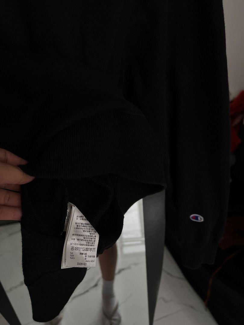 Champion Black Script Logo Sweatshirt Medium (Category: Coats, Jackets and Outerwear) located in Baguio. Submitted by pureearth.5f1c08 (Listing ID 1466901008, Image 3). Description: - Brand: Champion - Color: Black - Size: Medium - Design: White and red big script logo on chest, small embroidered 'C' logo patch on left sleeve cuff - Features: Ribbed collar, cuffs, and hem with a thick fleece interior - Condition: Clean shape and well maintained.